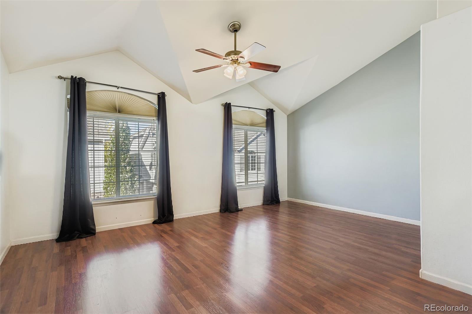 8320 Stonybridge Circle Littleton, CO 80126 - Photo 9 of 11 a view of an empty room with a window and wooden floor