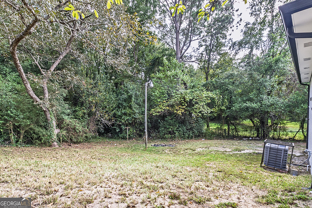 1124 North Beddingfield Drive Macon, GA 31206 - Photo 27 of 34 a backyard of a house with lots of green space