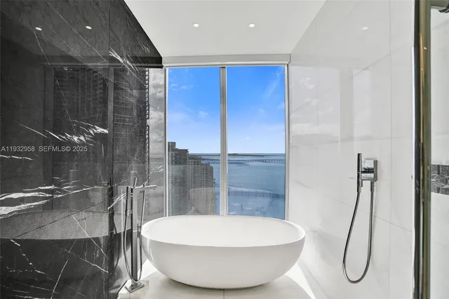 a view of a air conditioner and a floor to ceiling window