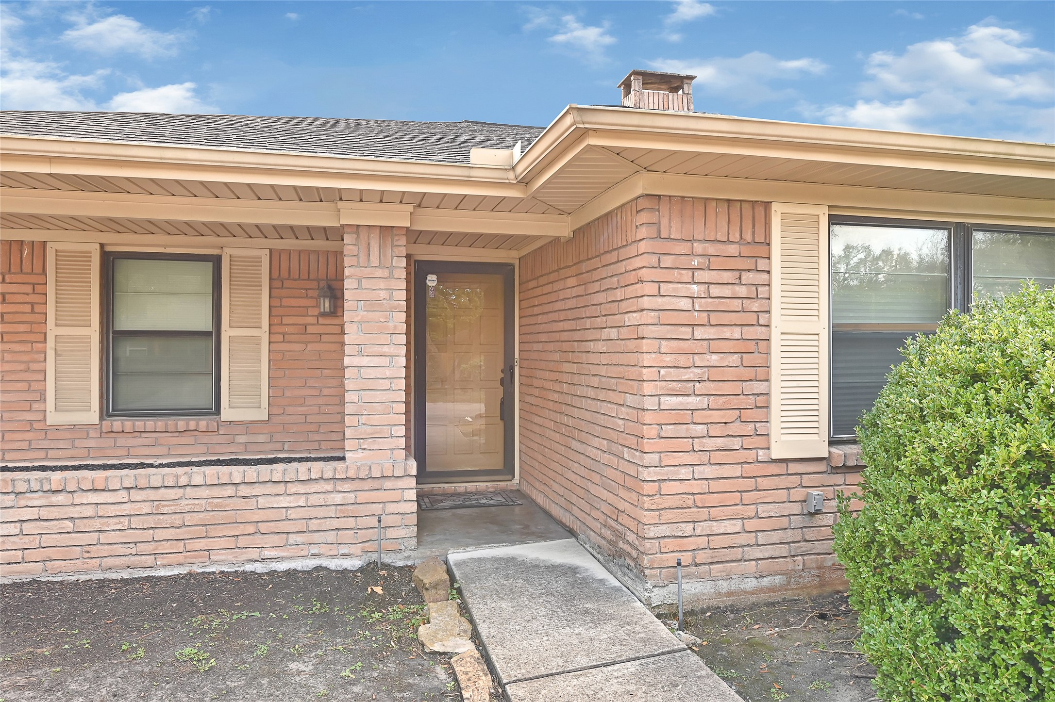 4831 Knickerbocker Street Houston, TX 77035 - Photo 6 of 50 Front elevation featuring brick facade, mature landscaping, and covered entry.