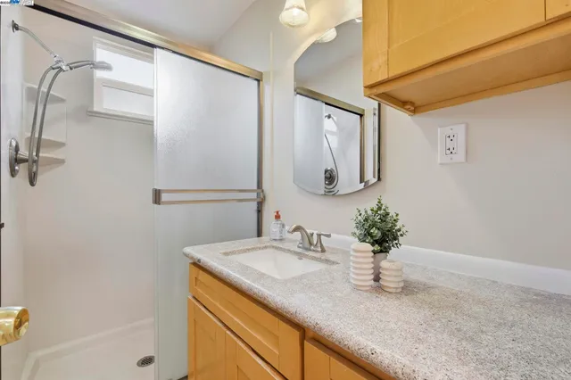 a living room with furniture and large windows