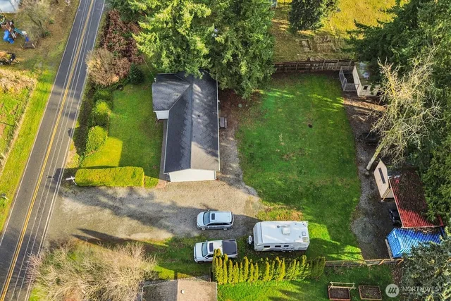 an aerial view of a house having swimming pool
