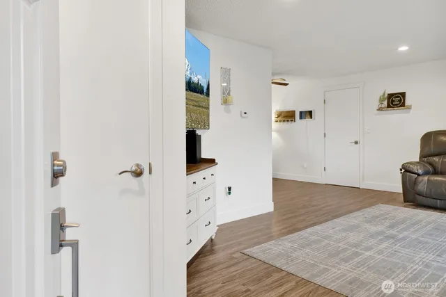 a view of a livingroom with wooden floor
