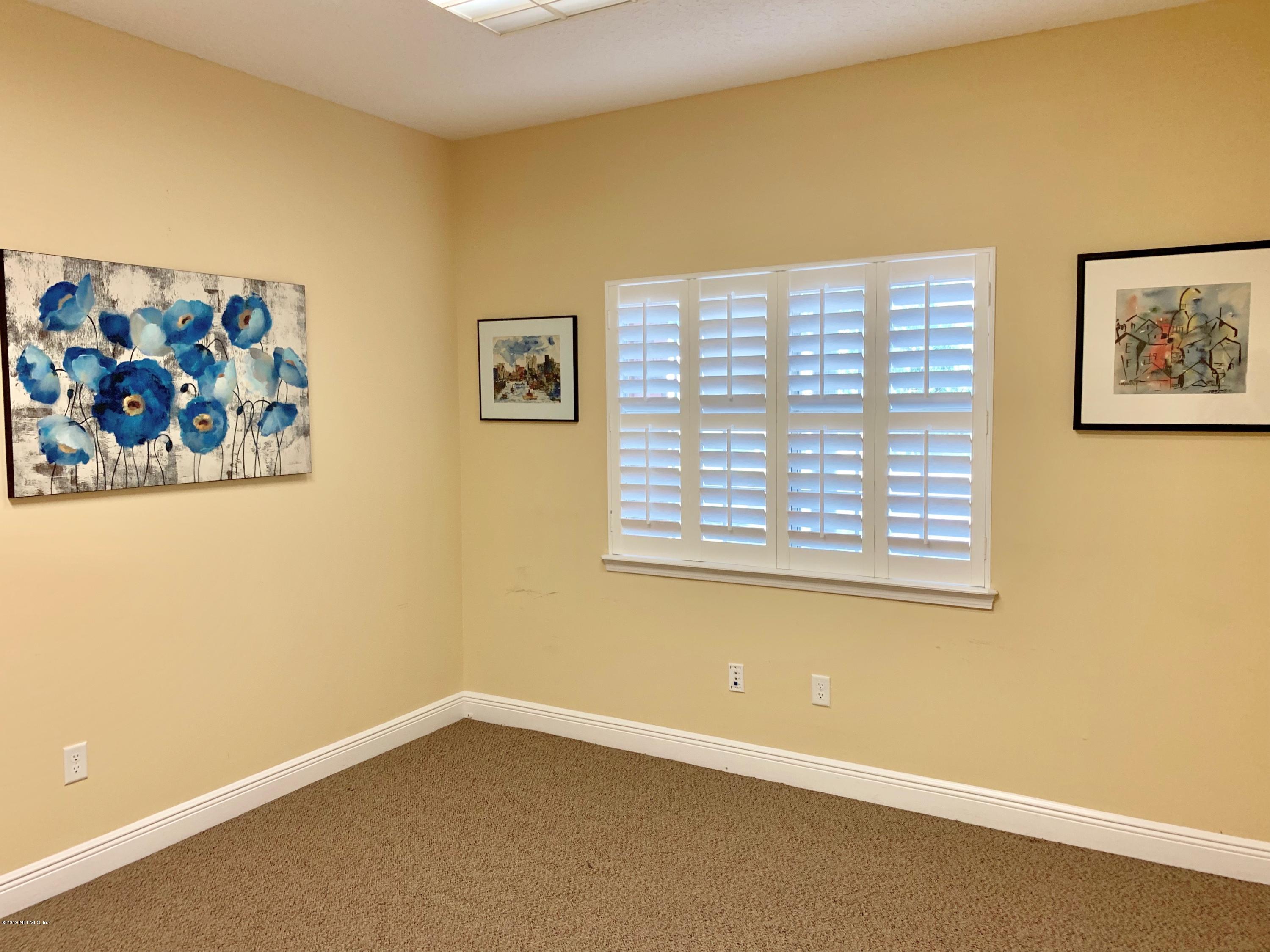 4465 Baymeadows Road, Unit 3 Jacksonville, FL 32217 - Photo 2 of 12 a view of an empty room with a window