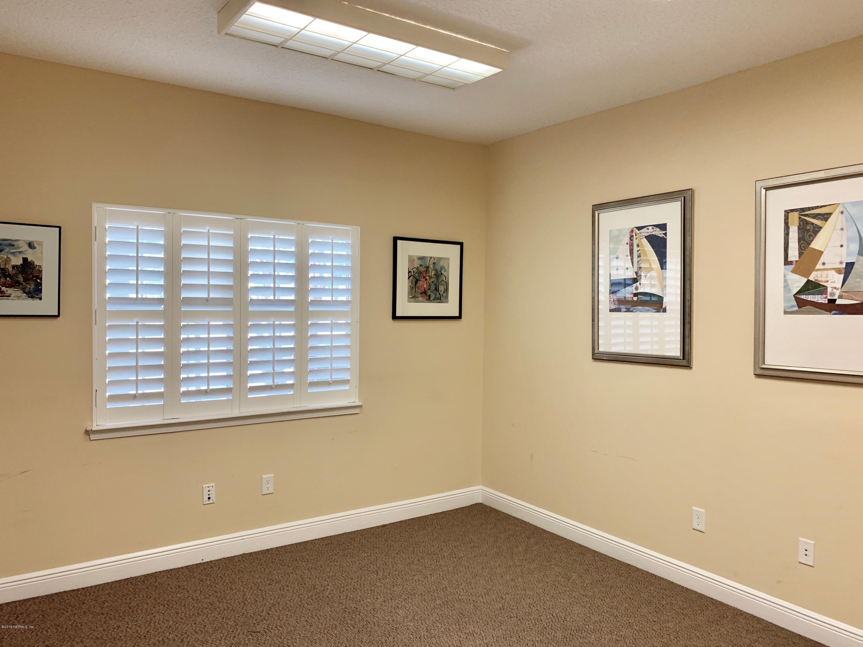 4465 Baymeadows Road, Unit 3 Jacksonville, FL 32217 - Photo 3 of 12 a view of an empty room with a window