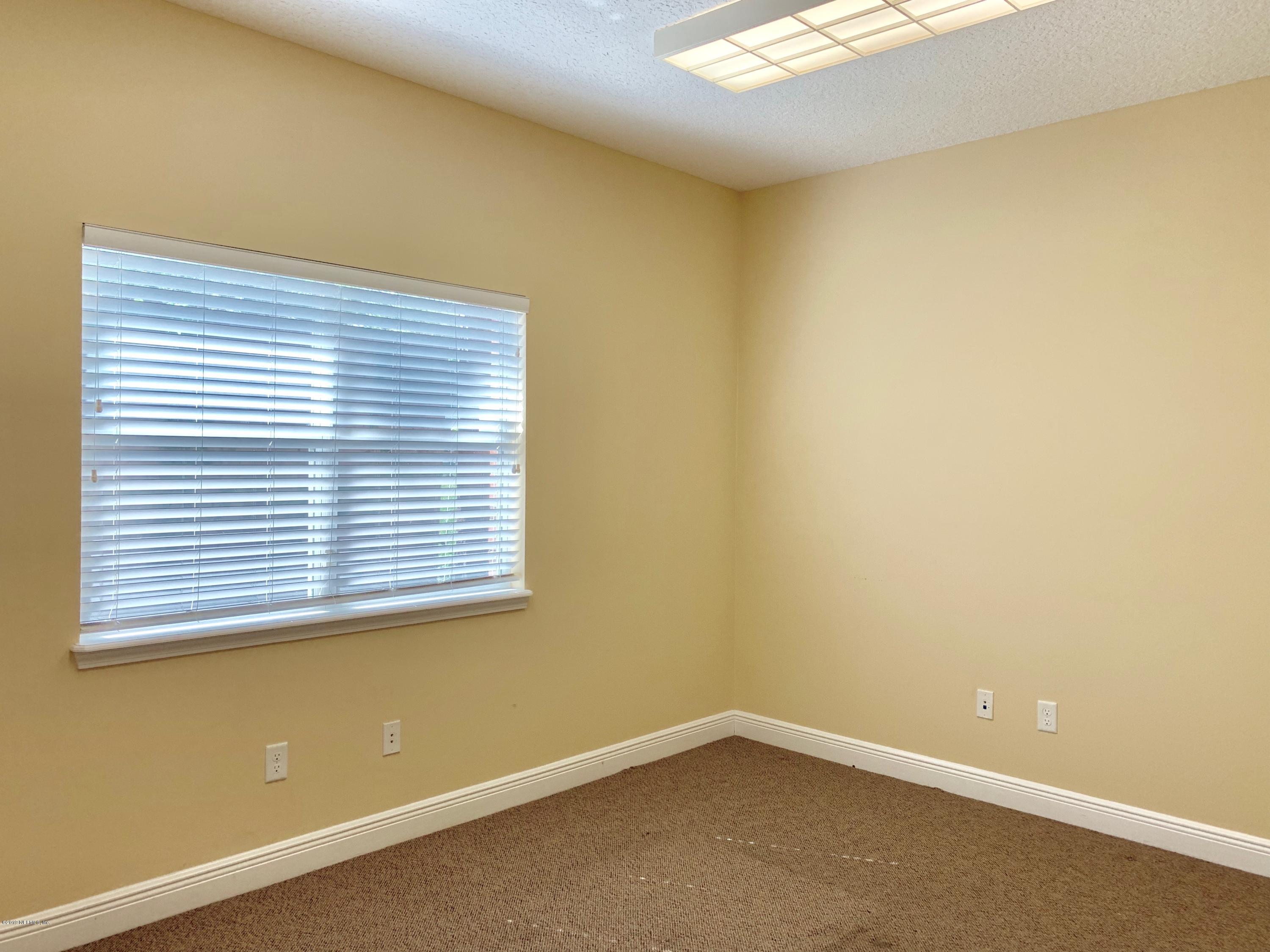 4465 Baymeadows Road, Unit 3 Jacksonville, FL 32217 - Photo 6 of 12 an empty room with a window