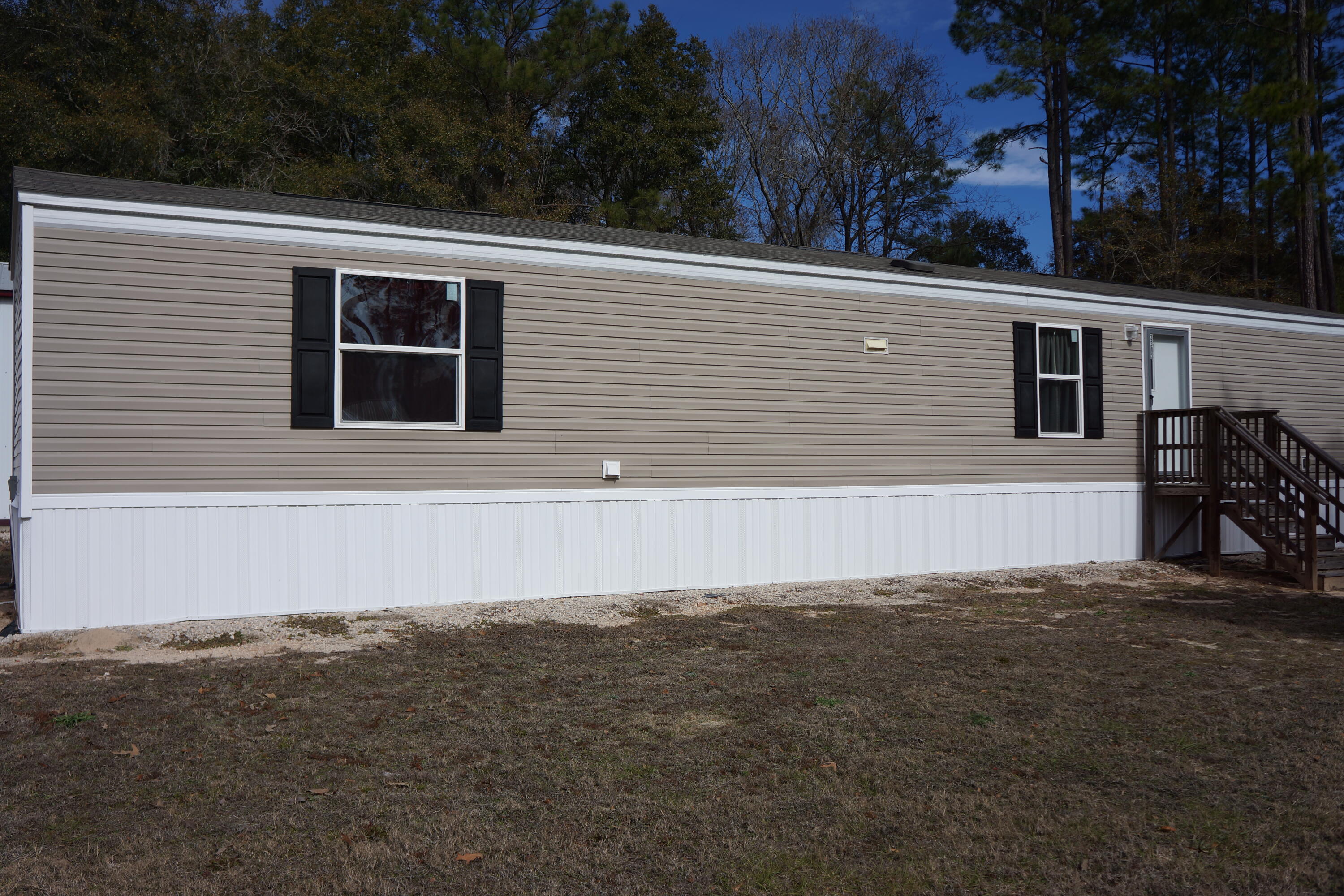 3031 Sandy Lane Crestview, FL 32536 - Photo 12 of 27 a view of a house with a yard