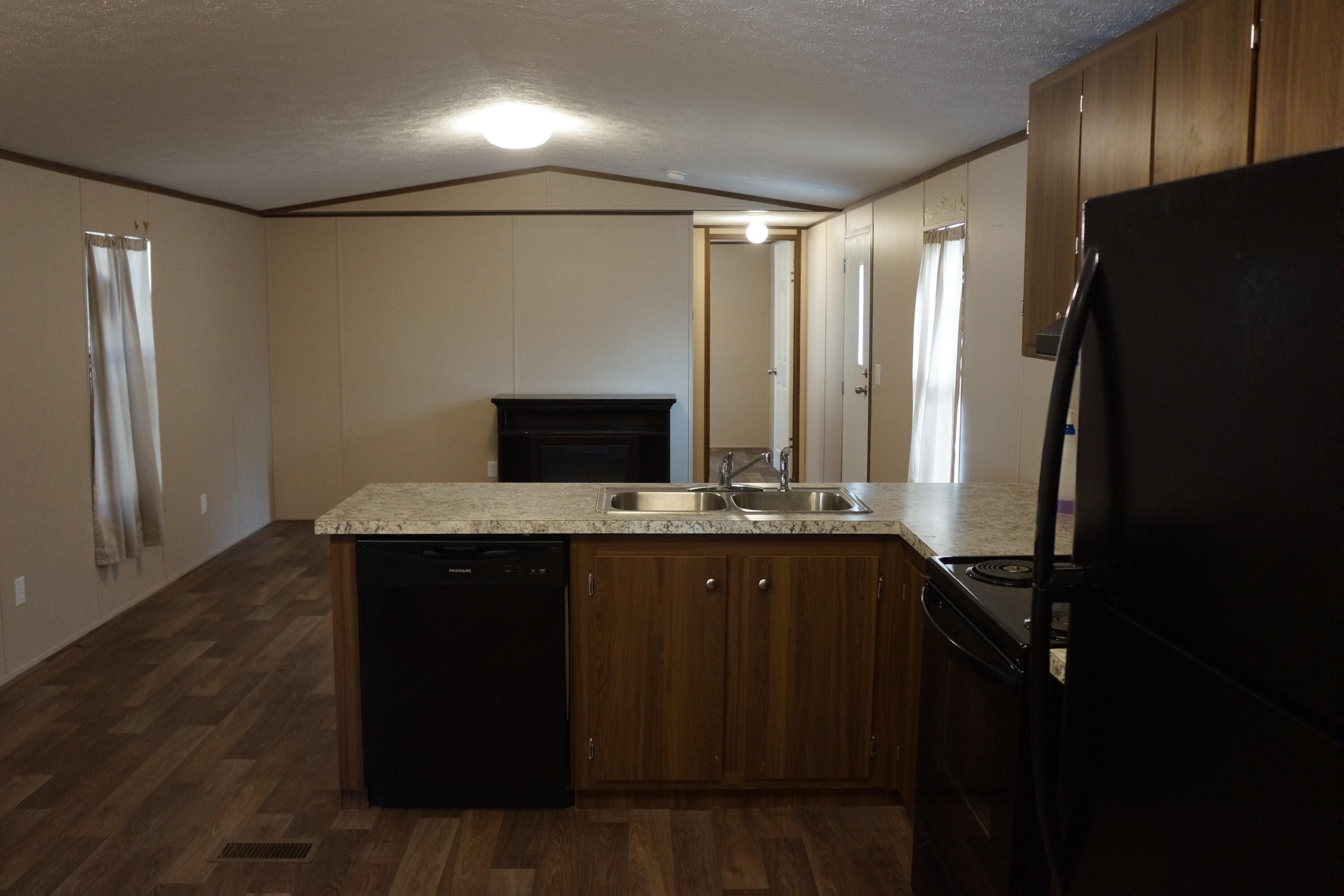 3031 Sandy Lane Crestview, FL 32536 - Photo 17 of 27 a view of kitchen with stainless steel appliances granite countertop a refrigerator and a sink