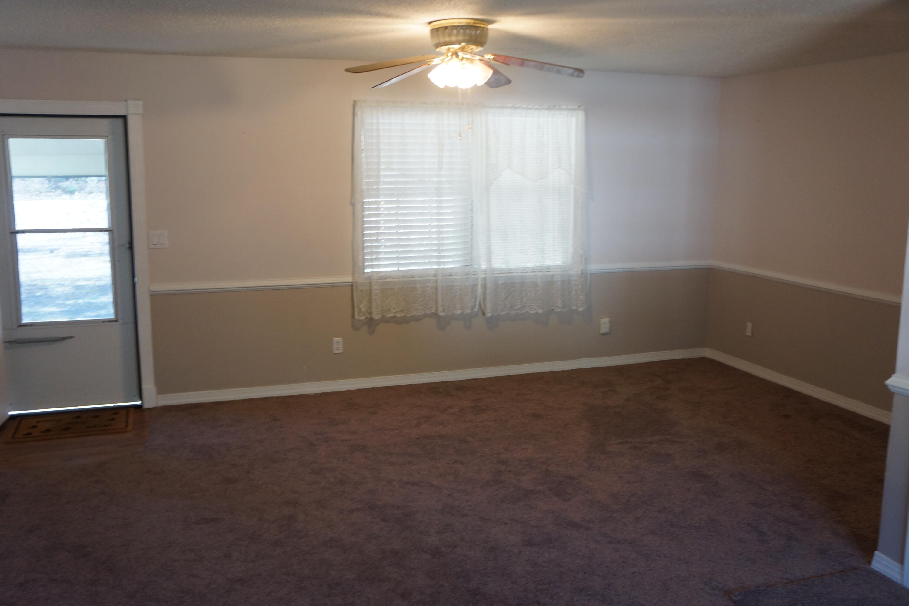 3031 Sandy Lane Crestview, FL 32536 - Photo 2 of 27 an empty room with a window