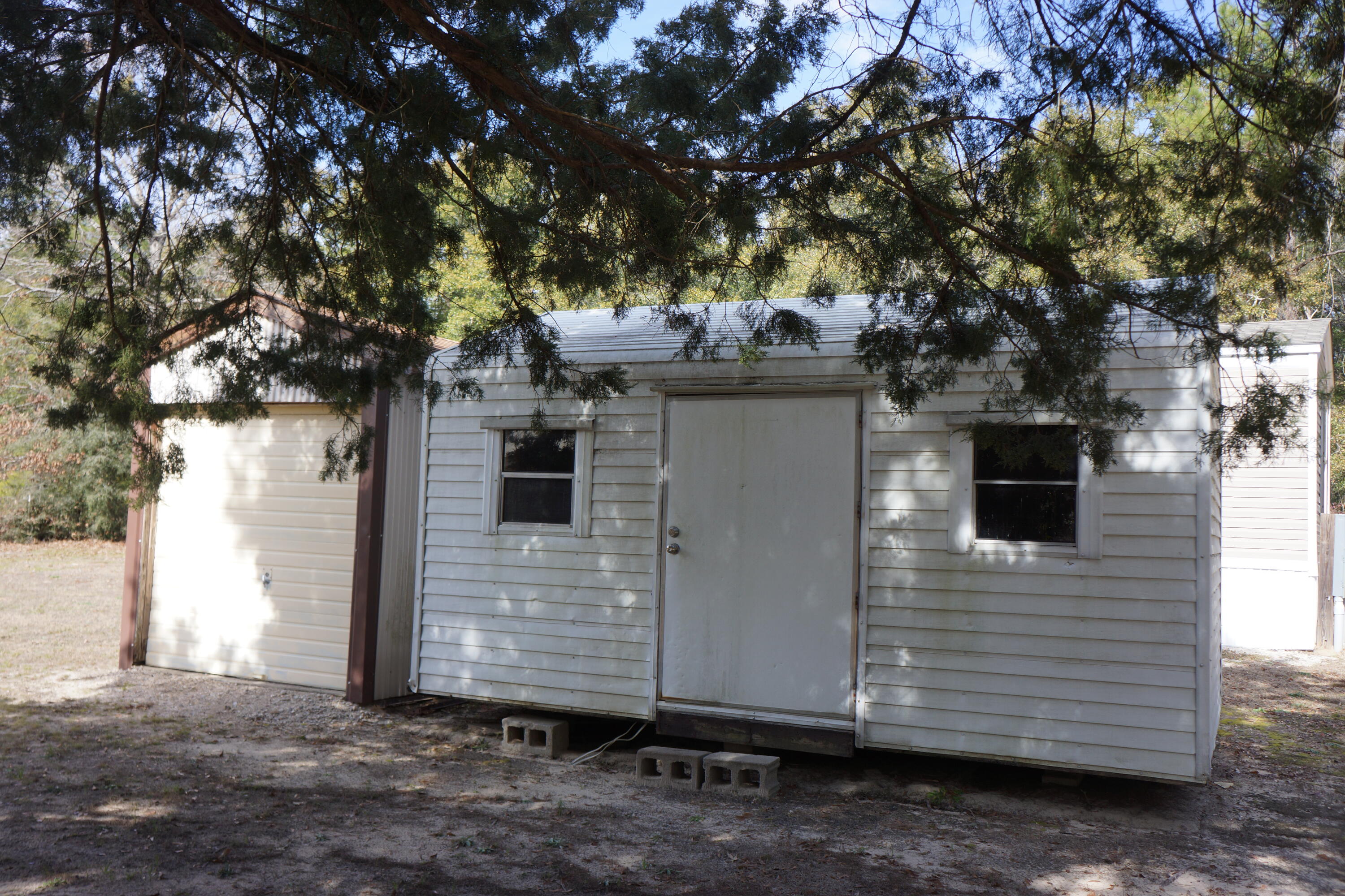 3031 Sandy Lane Crestview, FL 32536 - Photo 10 of 27 a view of a house with a tree