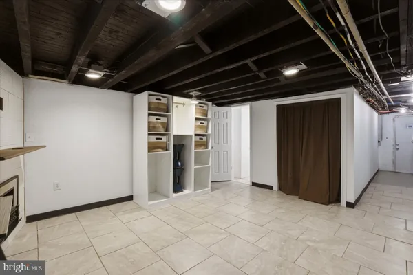 a bathroom with a toilet a sink and shower