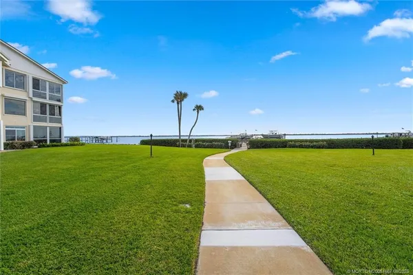 a view of a swimming pool with a yard