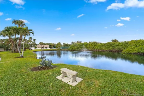 a lake view with a yard