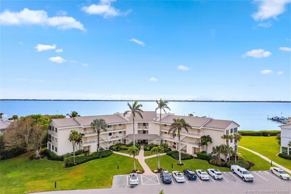 an aerial view of a house with a ocean view