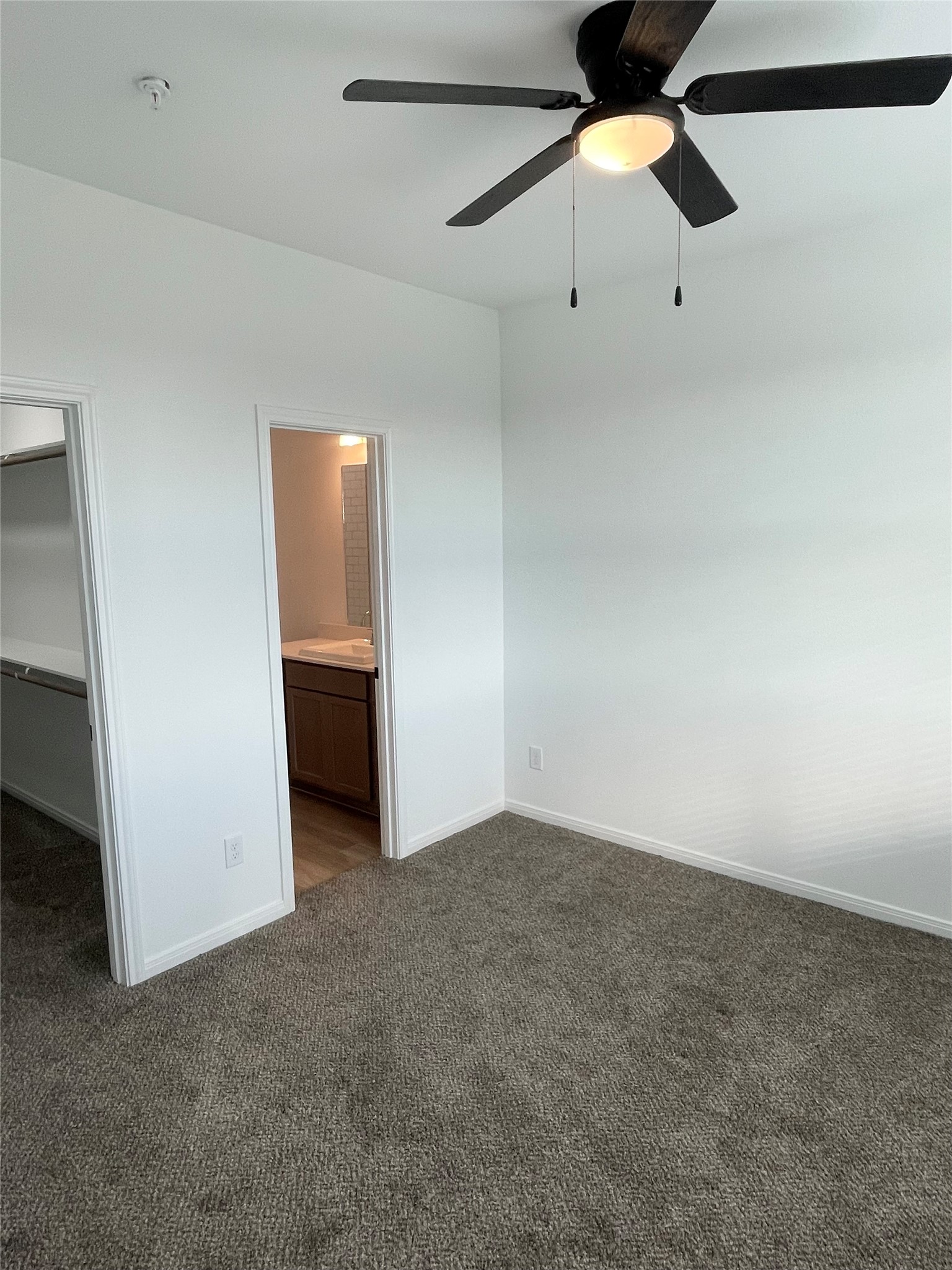 2400 Nile Valley Road Bay City, TX 77414 - Photo 16 of 25 an empty room with staircase and fan