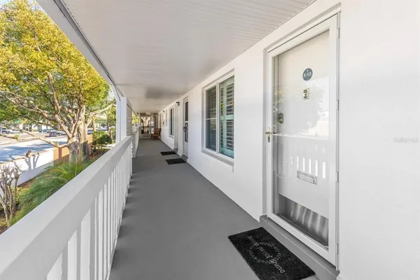 a view of balcony and wooden floor