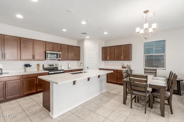 a kitchen with sink stove and cabinets