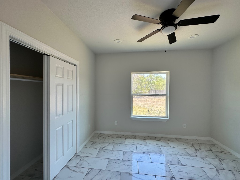 501 Maple Street Taylor, TX 76574 - Photo 12 of 18 a view of an empty room and window