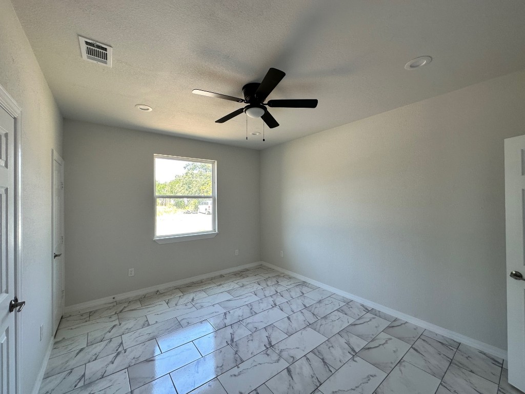 501 Maple Street Taylor, TX 76574 - Photo 13 of 18 a view of an empty room and window