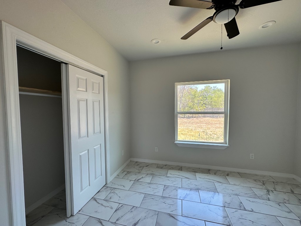 501 Maple Street Taylor, TX 76574 - Photo 10 of 18 a view of an empty room with a window
