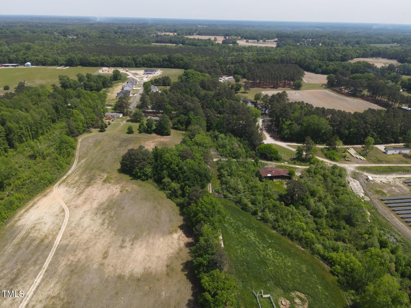 3701-2940 Wendell Road Wendell, NC 27591 - Photo 14 of 16 an aerial view of residential houses with outdoor space and trees