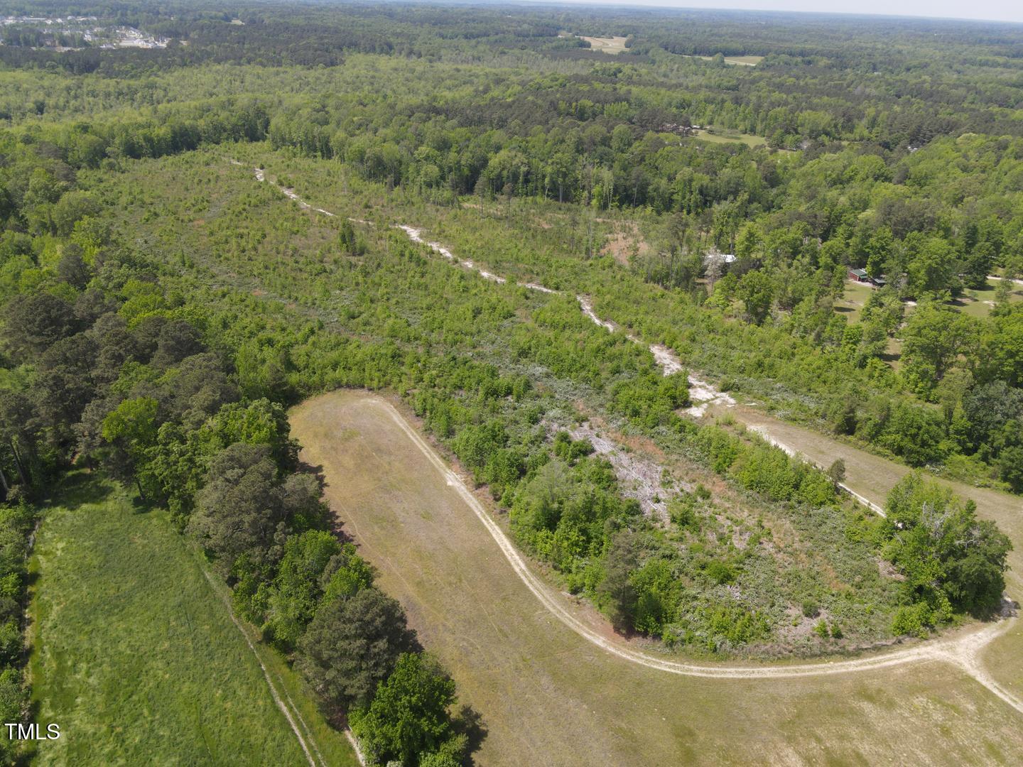 3701-2940 Wendell Road Wendell, NC 27591 - Photo 16 of 16 a view of a green yard with large trees