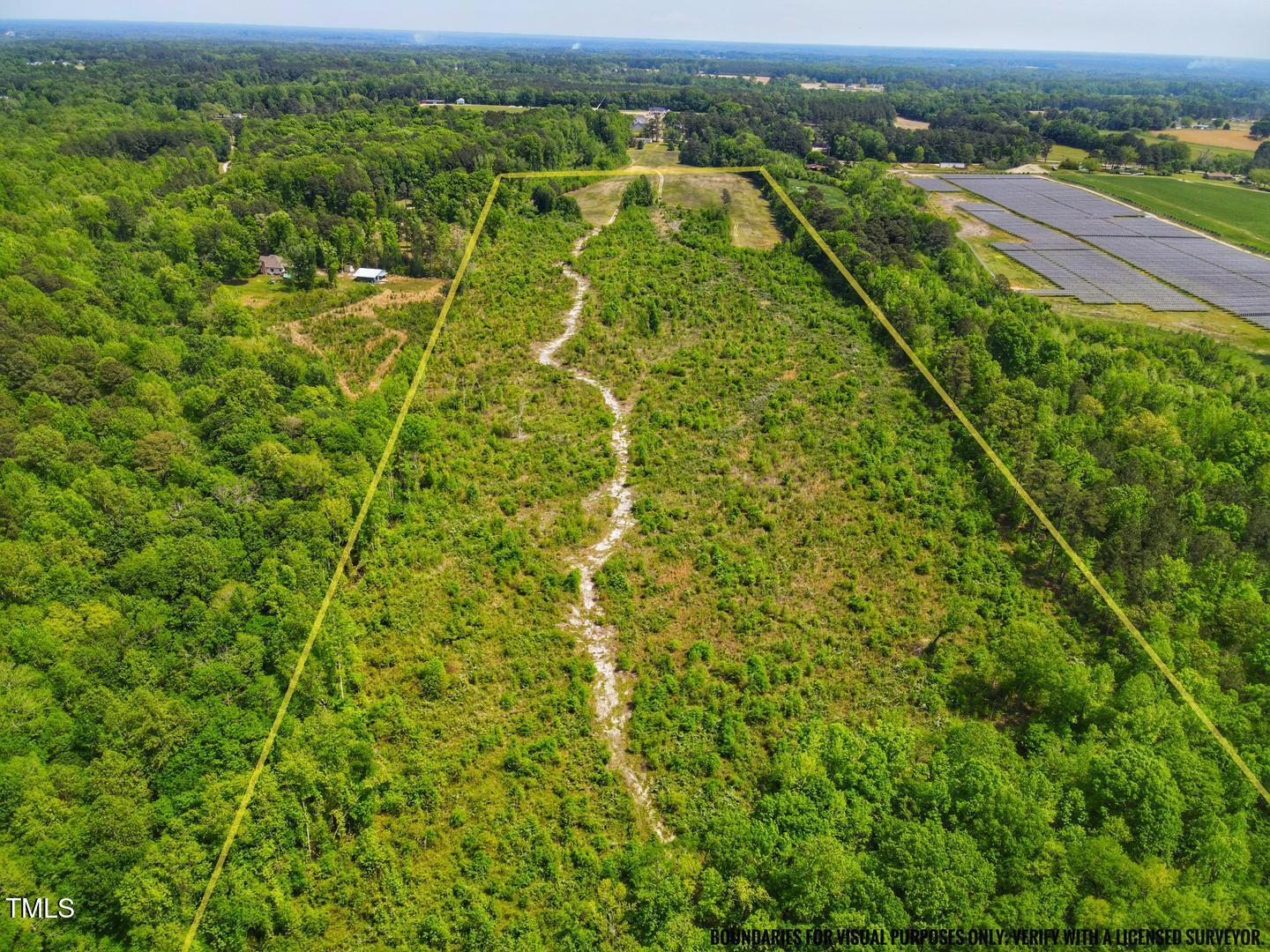 3701-2940 Wendell Road Wendell, NC 27591 - Photo 3 of 16 an aerial view of residential houses with outdoor space and trees