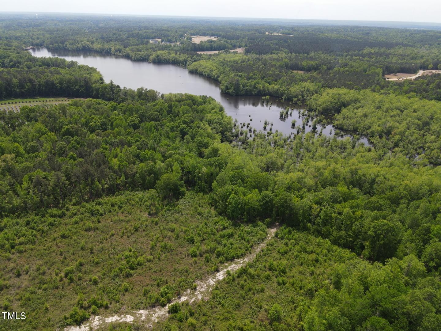 3701-2940 Wendell Road Wendell, NC 27591 - Photo 10 of 16 an aerial view of residential houses with outdoor space and trees