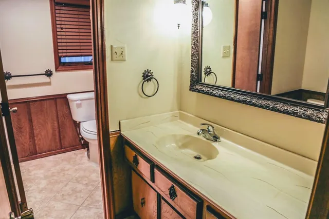 a bathroom with a sink and a mirror
