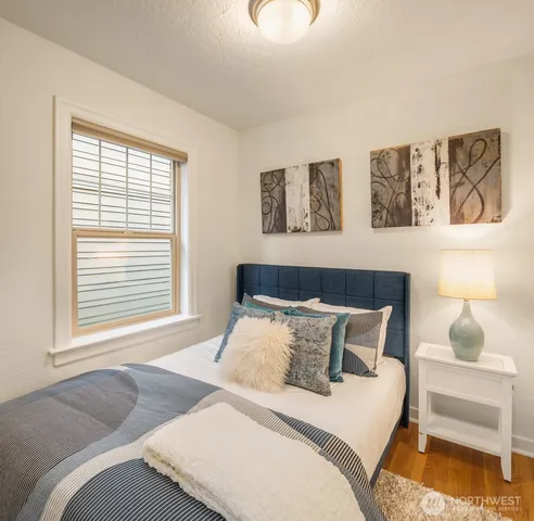 a bedroom with a bed and window