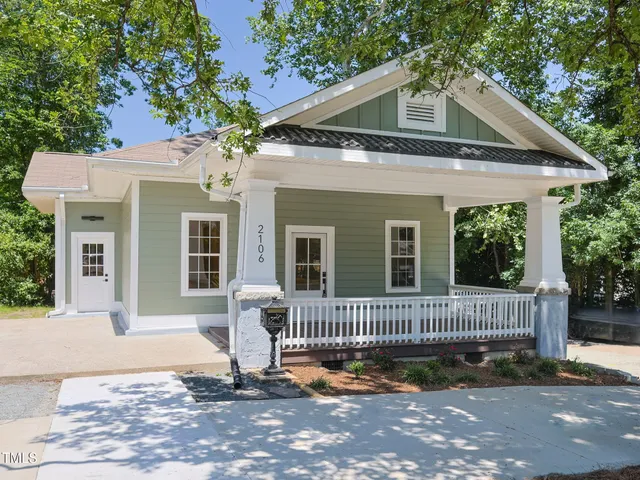 a front view of a house with a porch