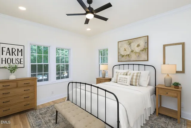 a bedroom with a large bed and a window