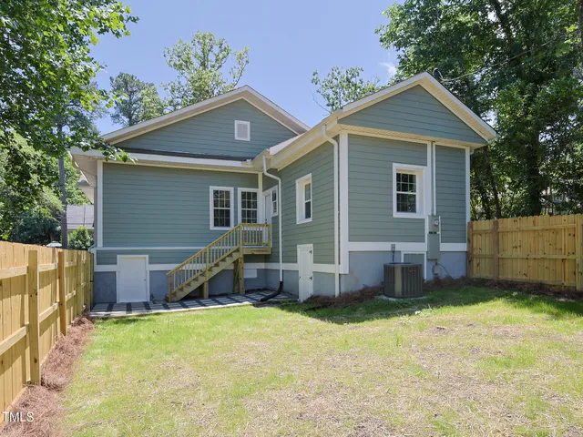 a view of a backyard with a small swimming pool
