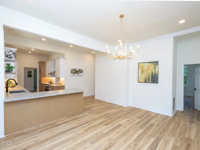 a view of a kitchen with granite countertop cabinets a sink and dishwasher