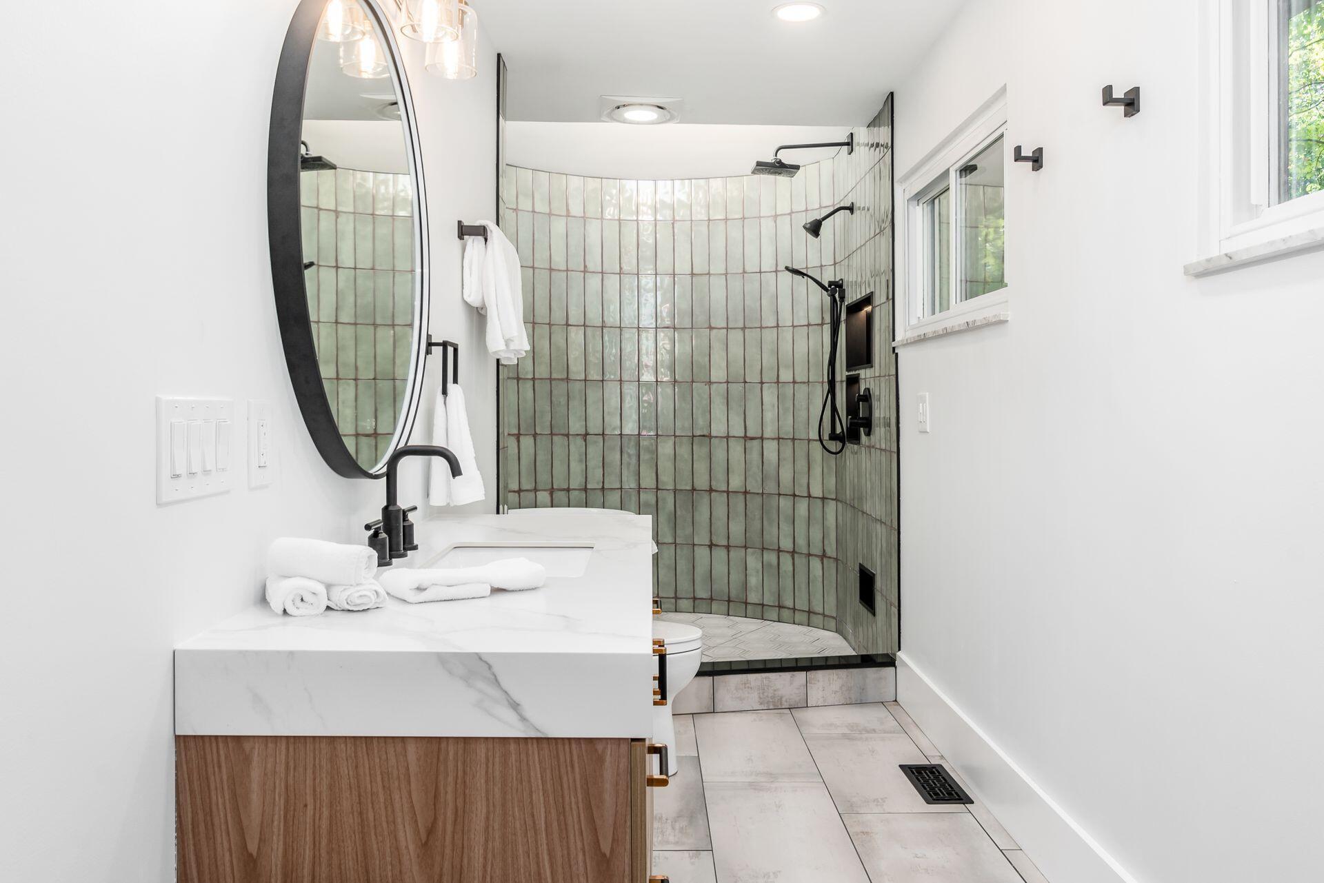 4610 Red Bank Road Galena, OH 43021 - Photo 40 of 88 Master bath features dual vanities each with storage and back-lit mirror, tile flooring, custom circular shower/bath combo.