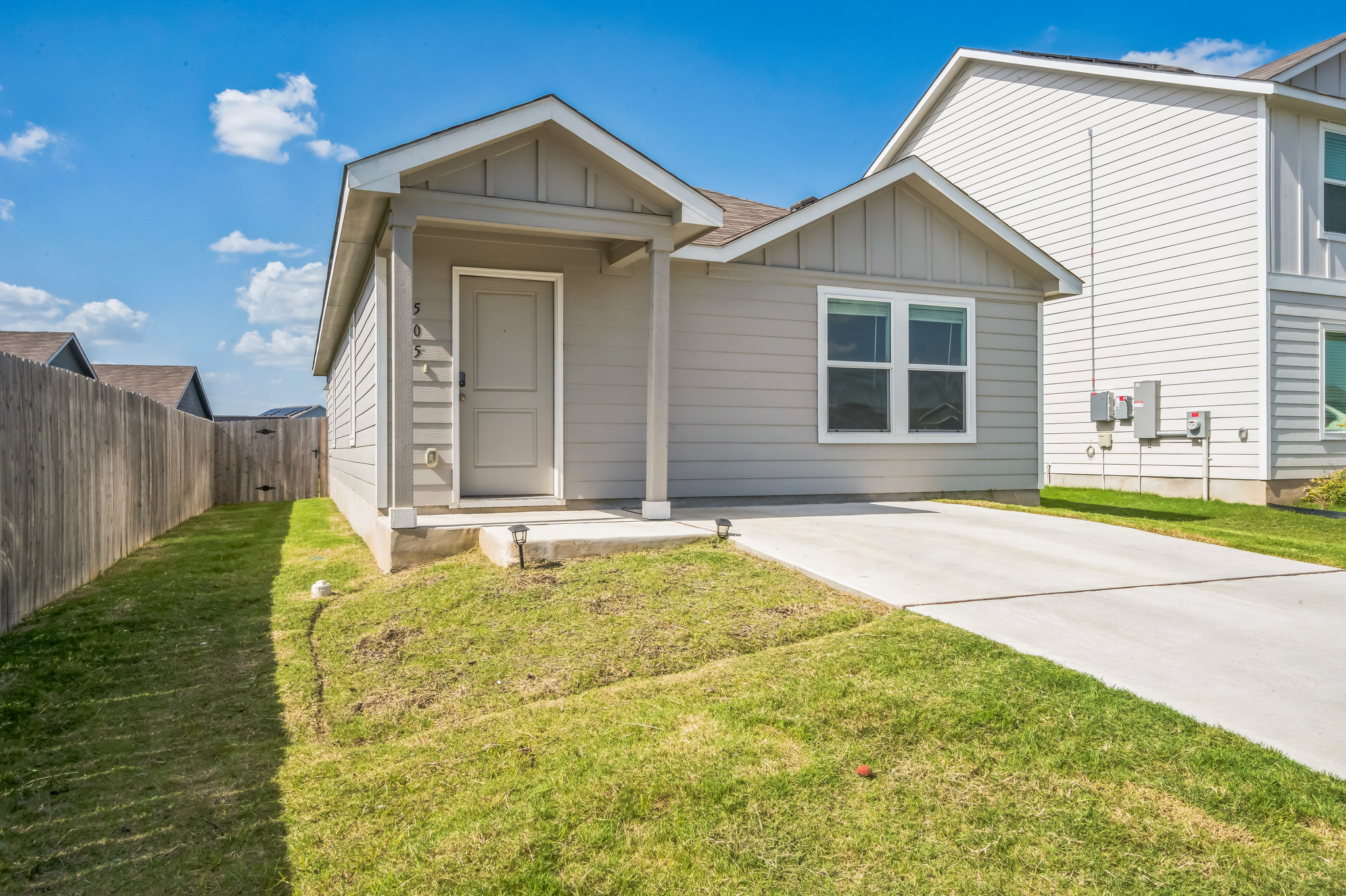 505 Sergeant Murphy Road Jarrell, TX 76537 - Photo 3 of 16 a front view of a house with a garden and yard
