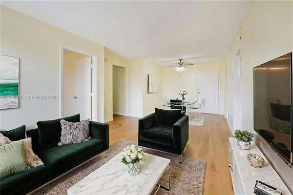 a living room with furniture and a flat screen tv