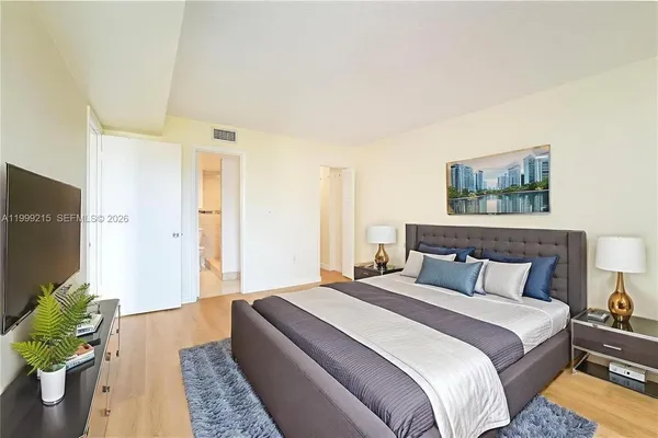 a bedroom with bed and a couch