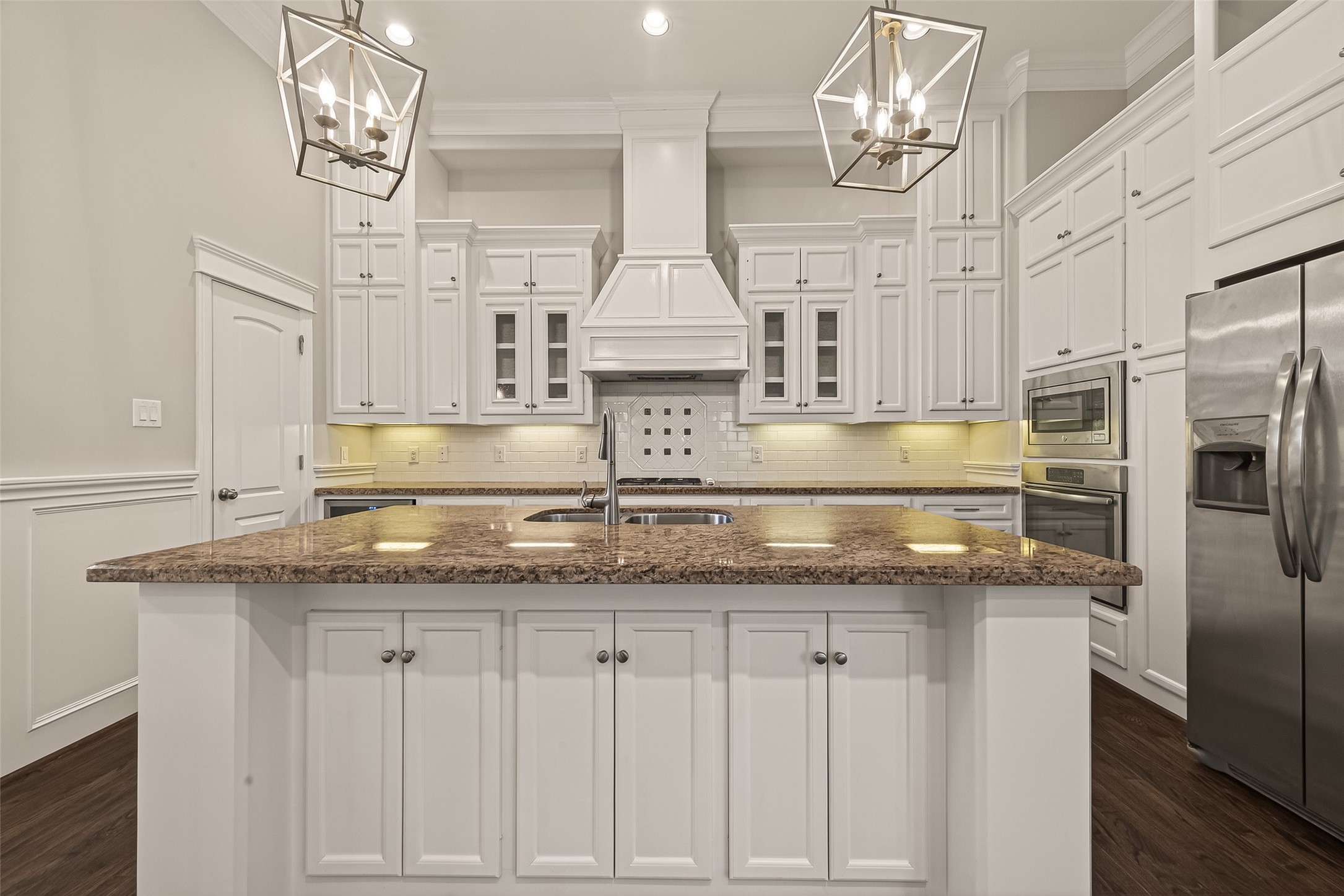 1431 West 25th Street Houston, TX 77008 - Photo 13 of 43 a kitchen with kitchen island granite countertop stainless steel appliances a sink and cabinets