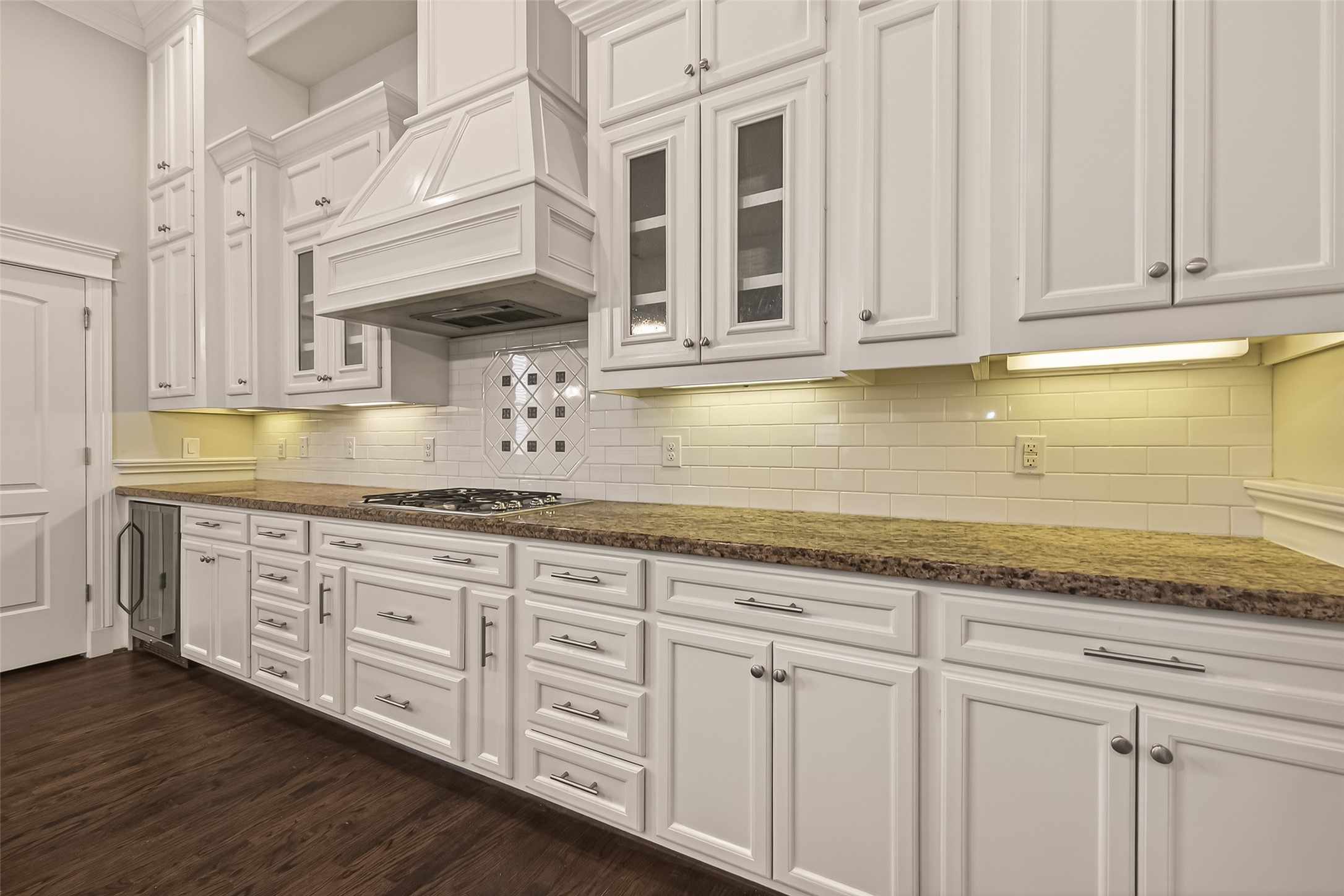 1431 West 25th Street Houston, TX 77008 - Photo 16 of 43 a kitchen with stainless steel appliances granite countertop a sink and dishwasher a granite countertops with wooden floor