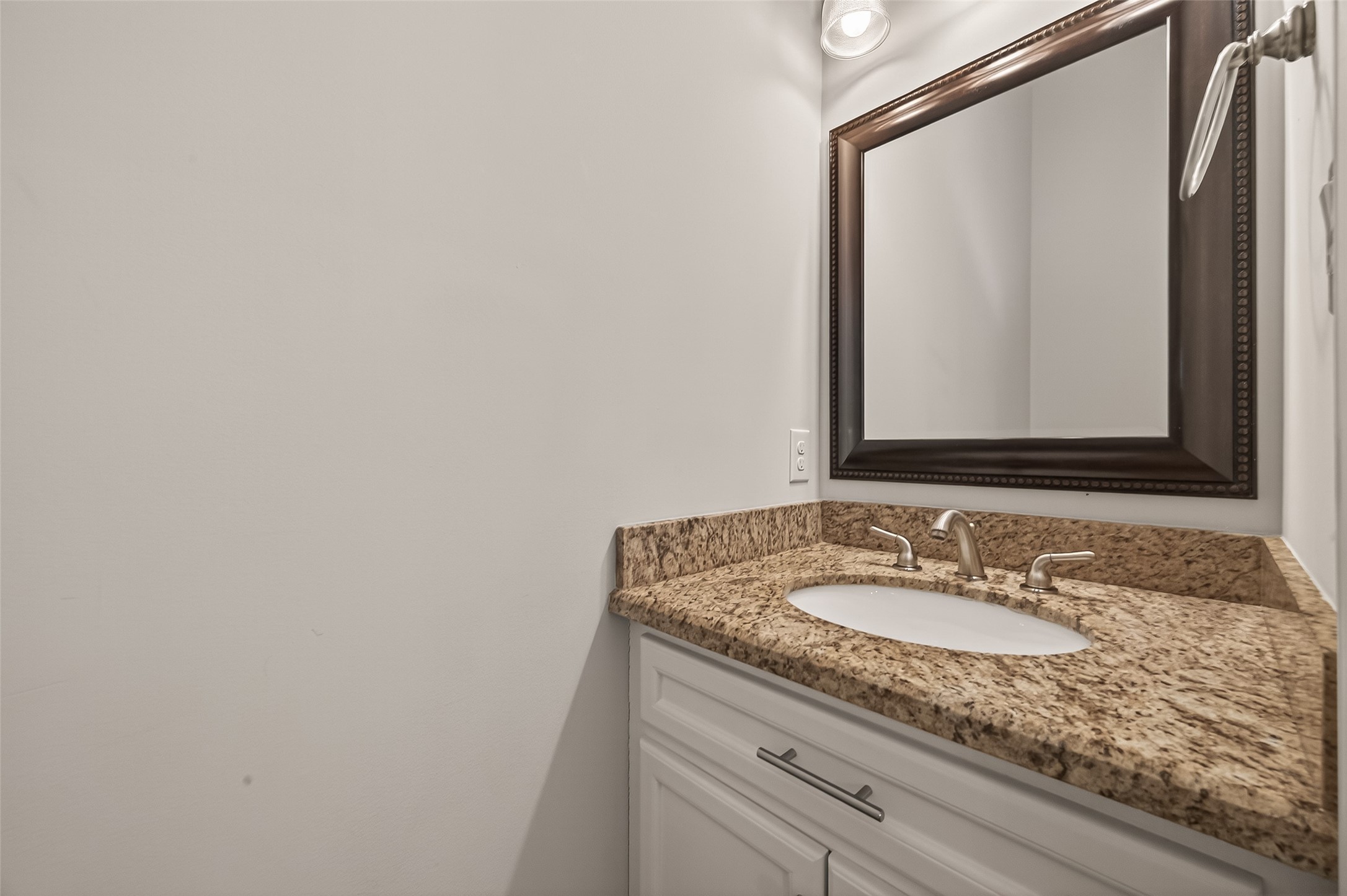 1431 West 25th Street Houston, TX 77008 - Photo 21 of 43 a bathroom with a granite countertop sink and a mirror