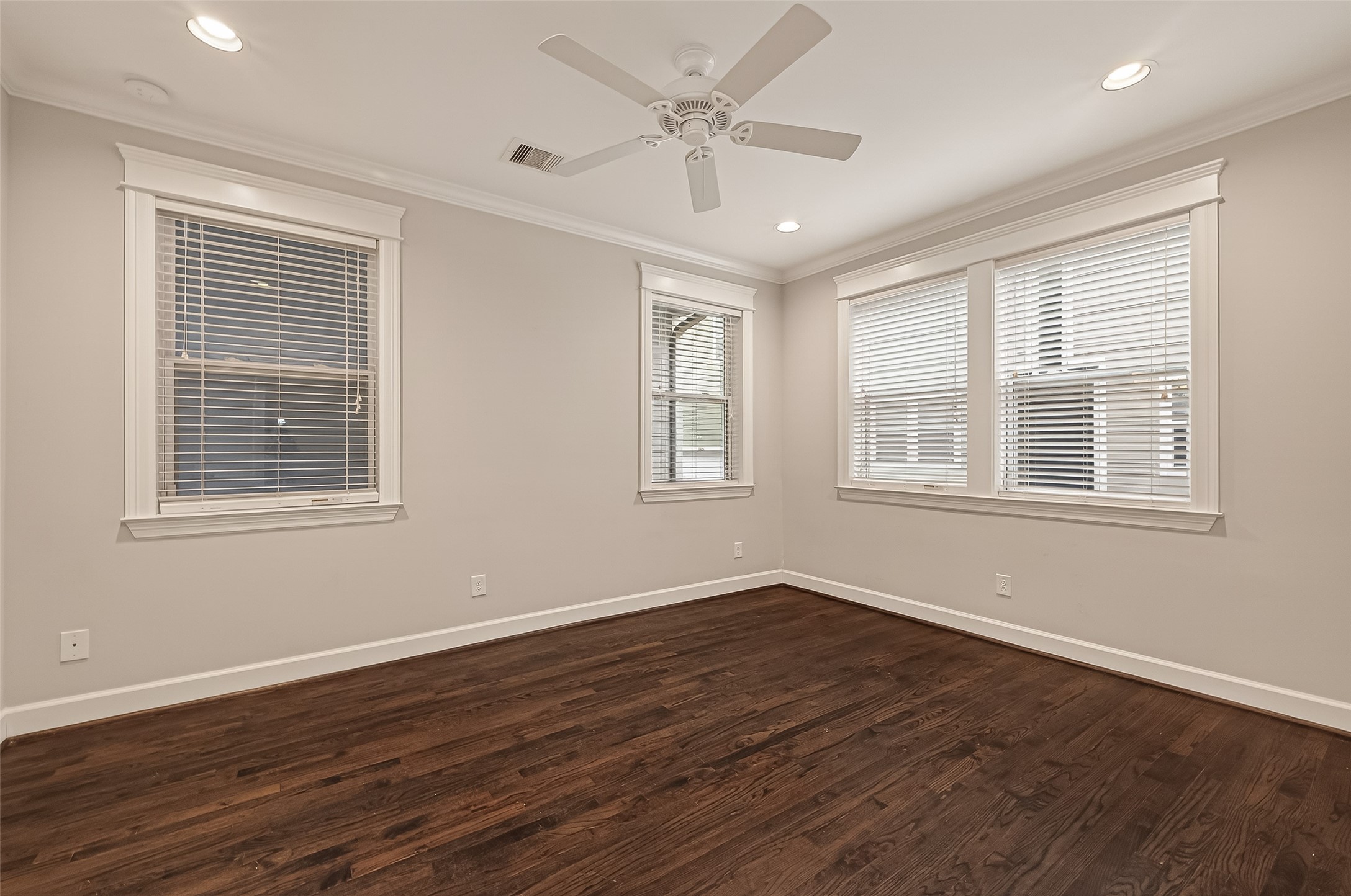 1431 West 25th Street Houston, TX 77008 - Photo 23 of 43 a view of an empty room with wooden floor and a window