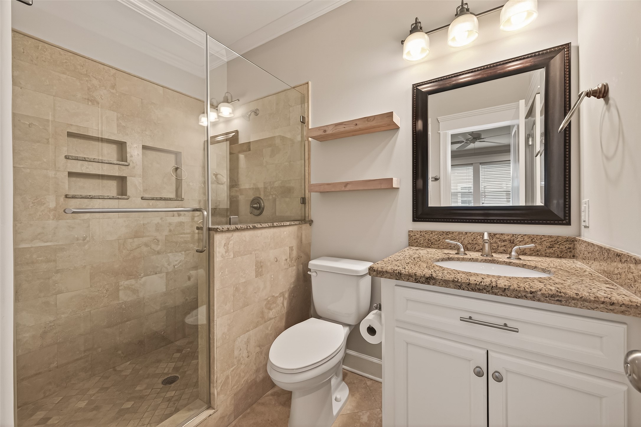 1431 West 25th Street Houston, TX 77008 - Photo 26 of 43 a bathroom with a granite countertop sink toilet and shower