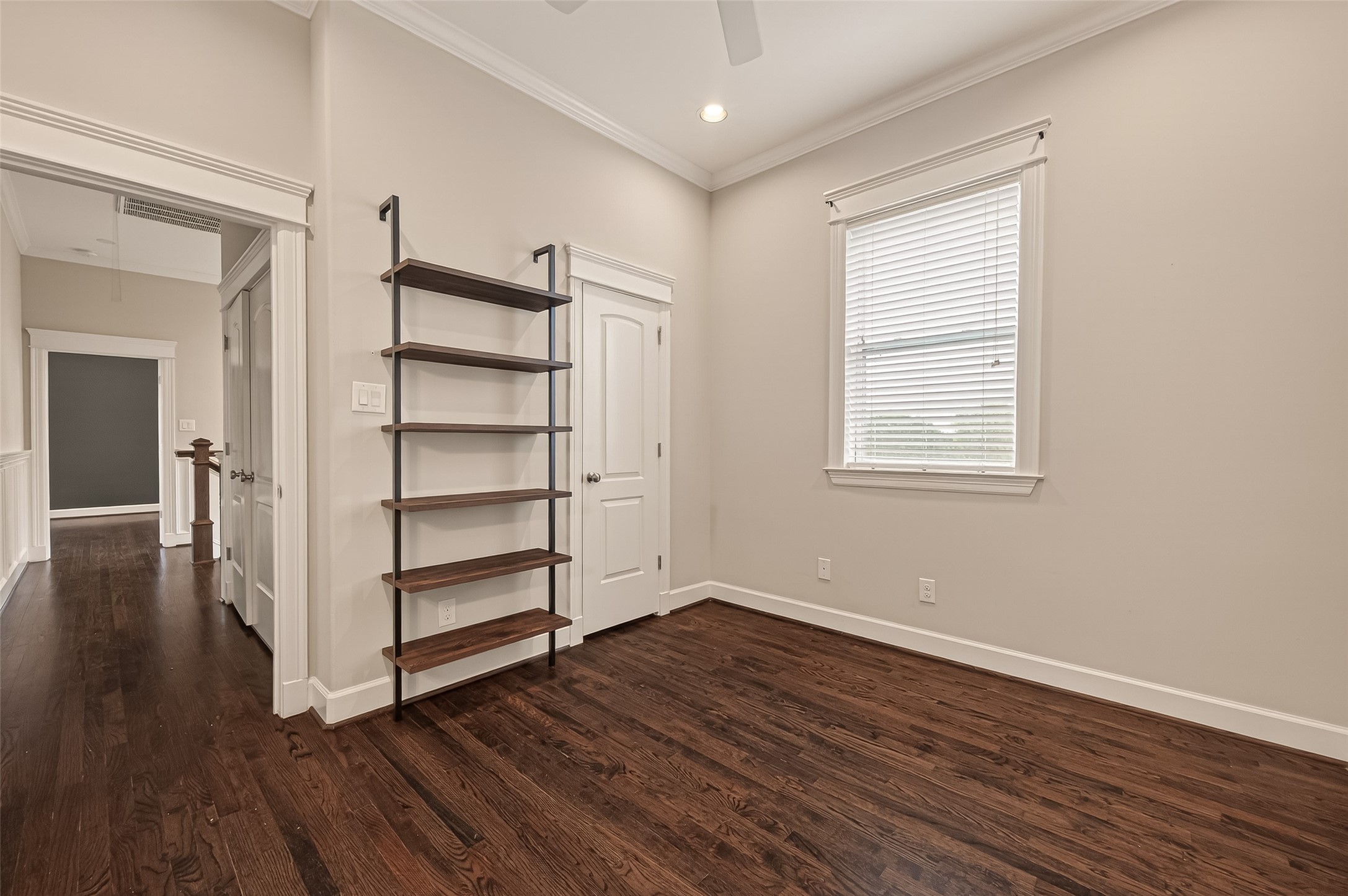 1431 West 25th Street Houston, TX 77008 - Photo 29 of 43 an empty room with wooden floor closet and windows