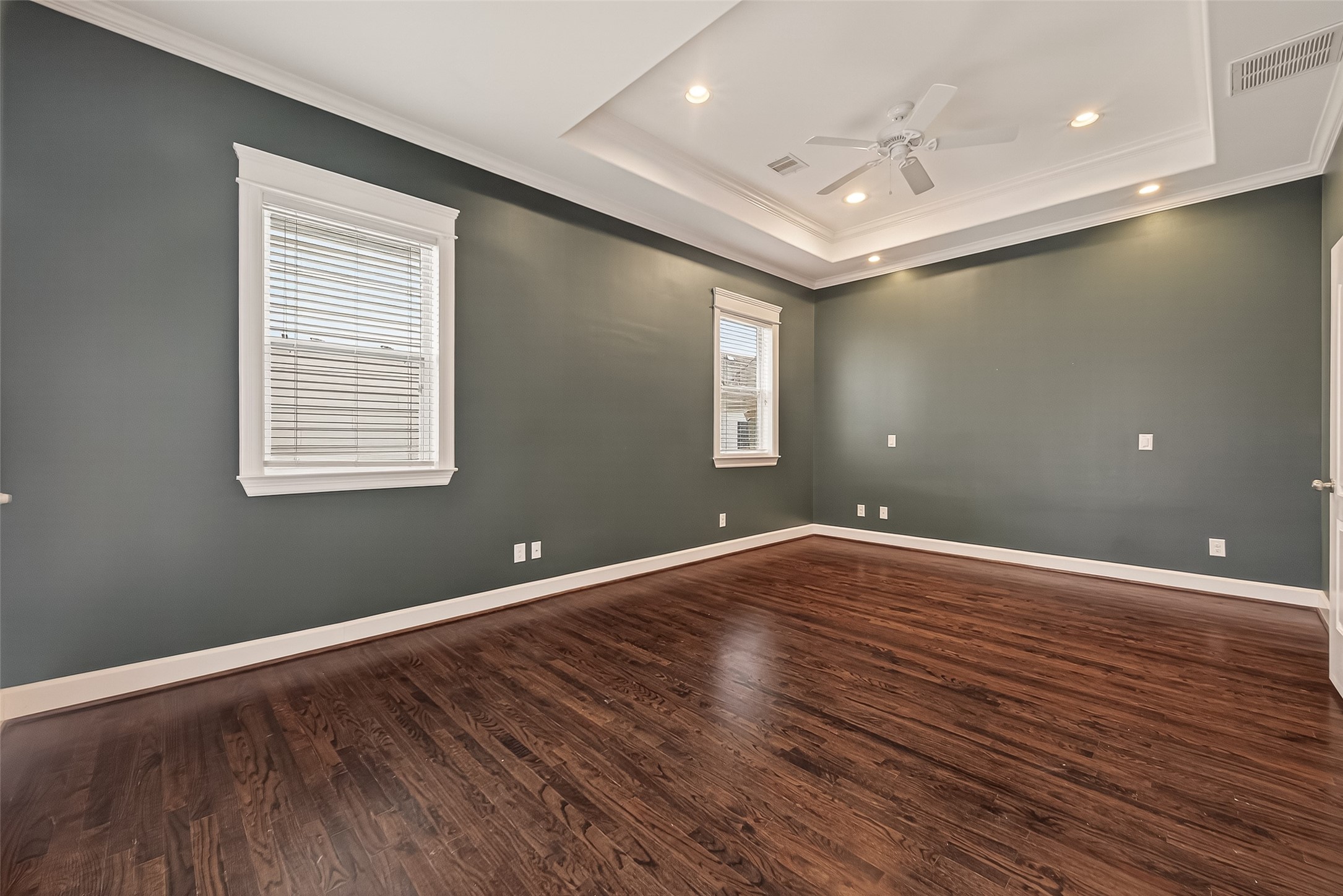 1431 West 25th Street Houston, TX 77008 - Photo 36 of 43 a view of an empty room with wooden floor and a window