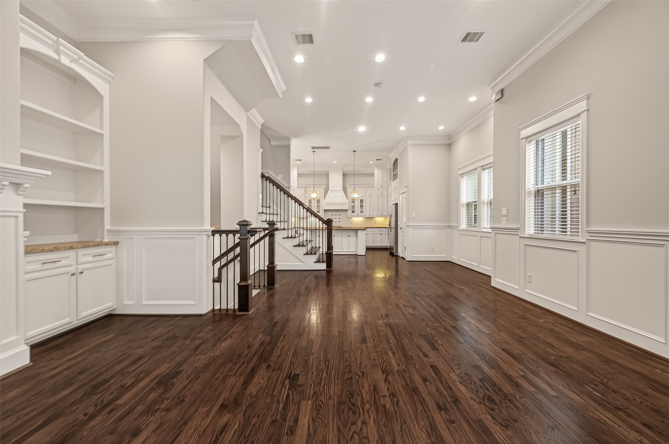 1431 West 25th Street Houston, TX 77008 - Photo 9 of 43 a view of a kitchen with wooden floor and electronic appliances