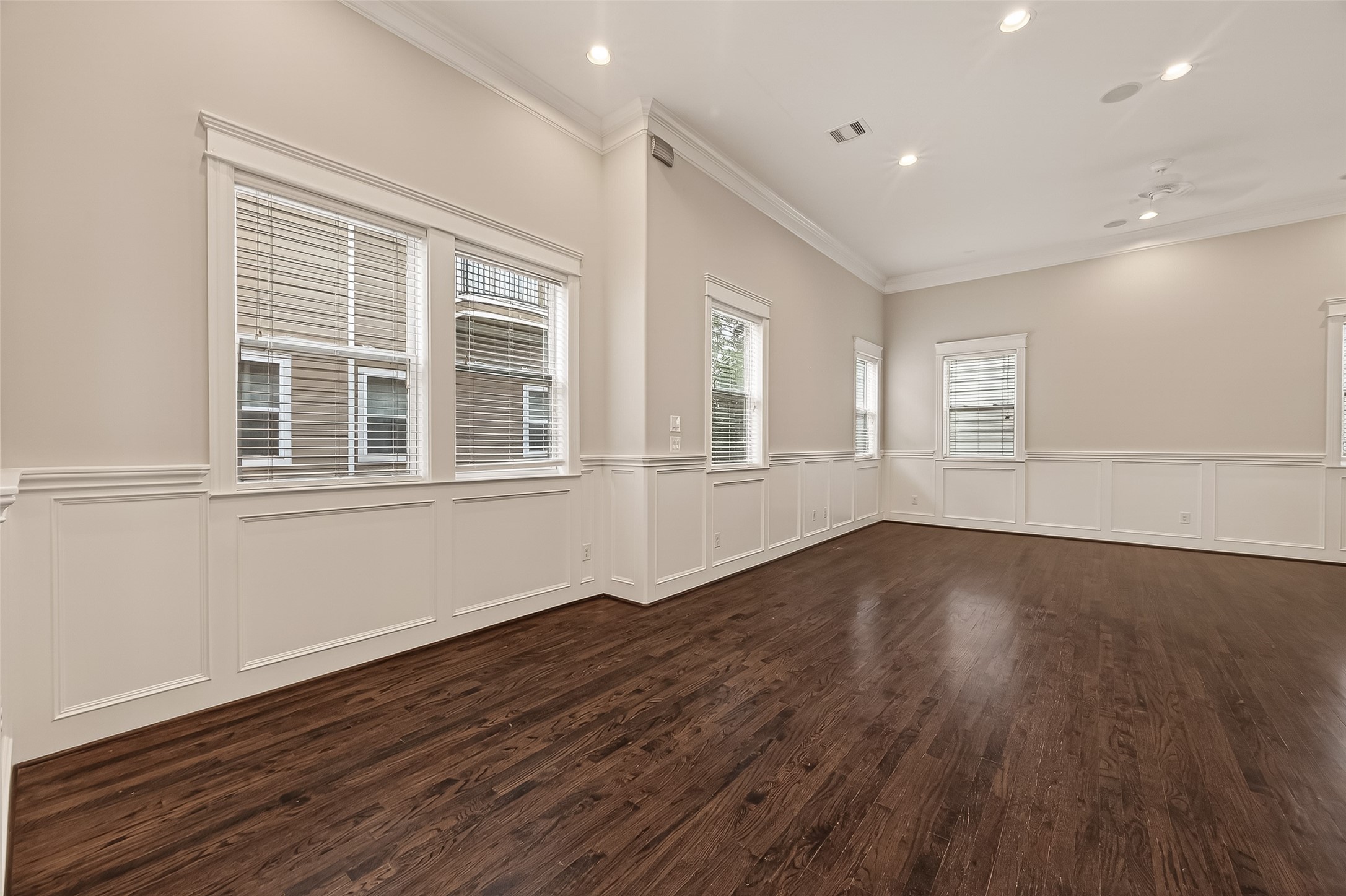 1431 West 25th Street Houston, TX 77008 - Photo 10 of 43 a view of an empty room with wooden floor and a window