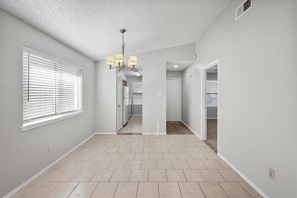 5821 Mansfield Road Arlington, TX 76017 - Photo 9 of 24 a view of an empty room with a window