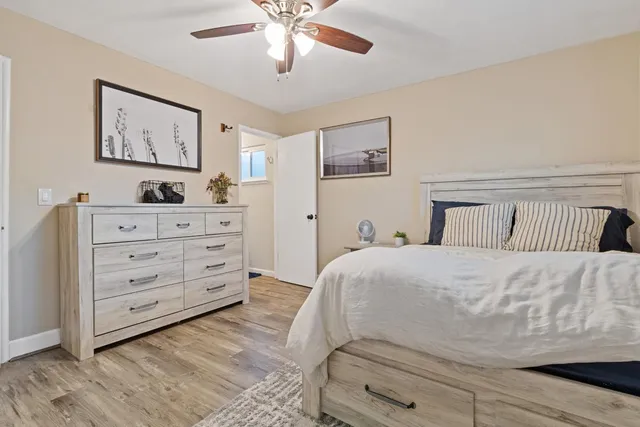 a bedroom with a bed and a dresser