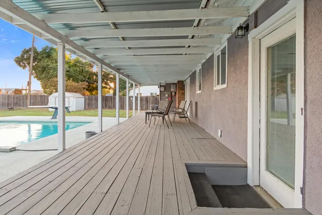 a view of outdoor space with wooden floor